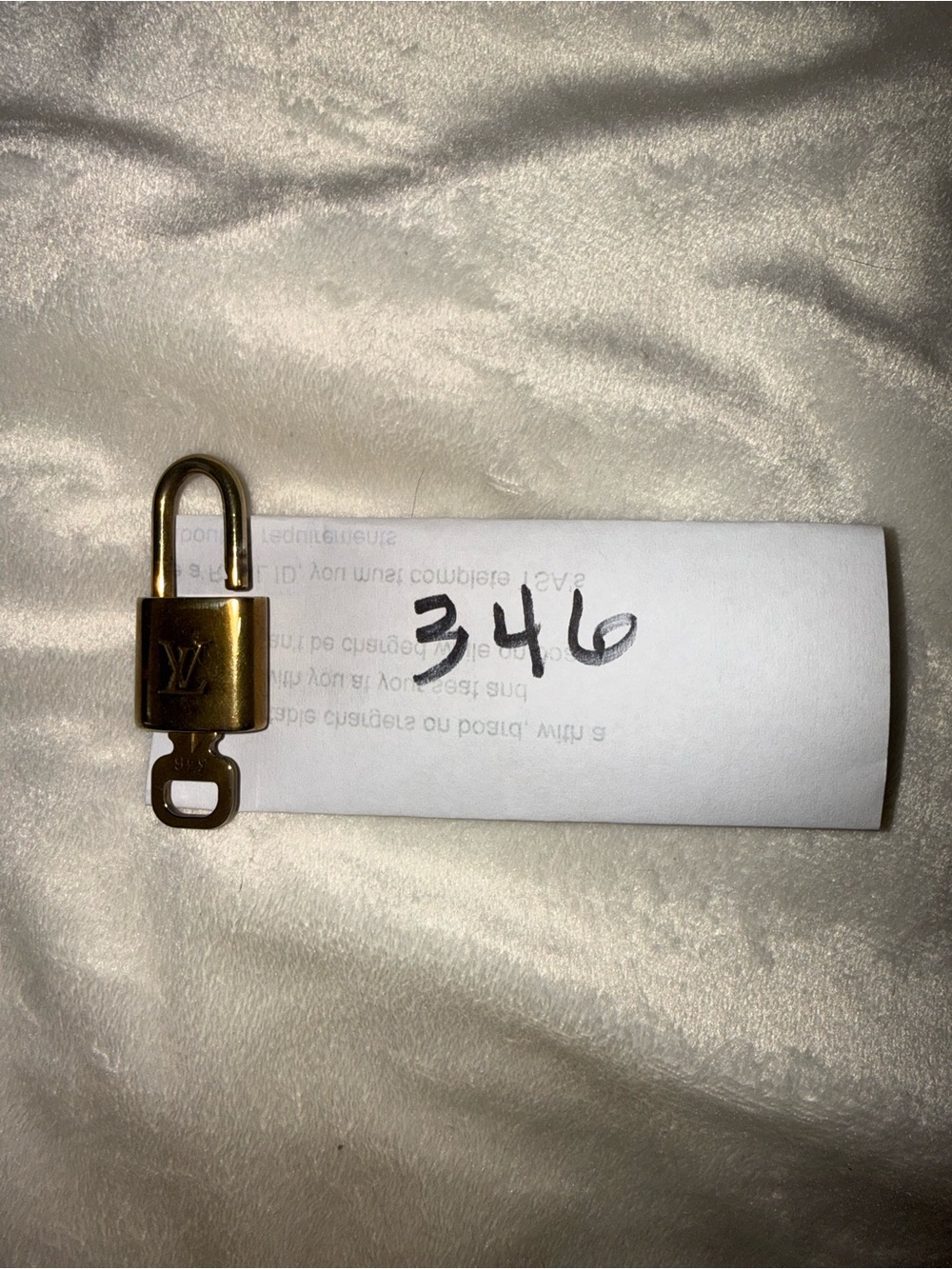 Louis Vuitton Gold Padlock and key 346 with LV Monogram.